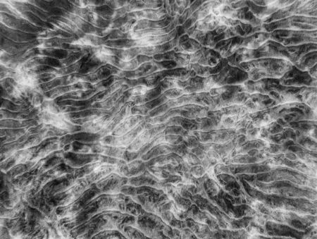 Patterns and shapes in sandy ocean floor.  Black and white abstract underwater image from Hawaii.の写真素材