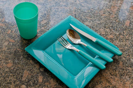 set of plastic plate with knife, fork and spoon