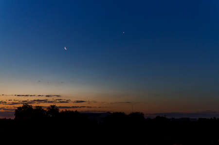 sunset with crescent moon