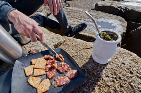 eating salami at the coastの写真素材