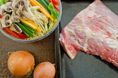 preparing meat with vegetablesの写真素材