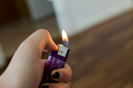 setting fire with the lighterの写真素材