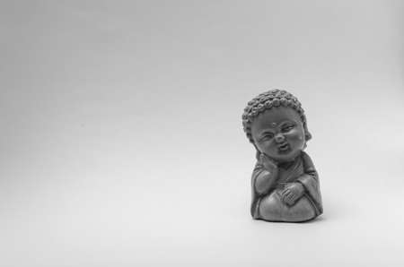 colorful buddha figures with grey background.の写真素材