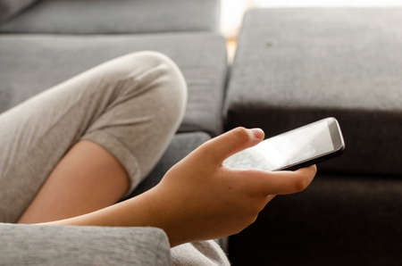 Teen using the cell phone. text, messages, internet games.