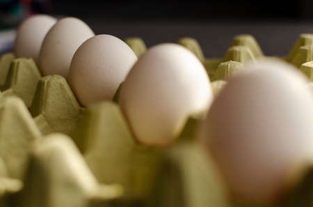 a pack of white farm eggs
