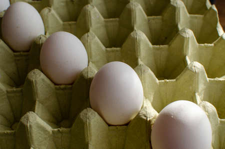 a pack of white farm eggs