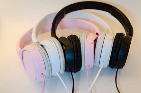 Headphones different colors. man womanの写真素材