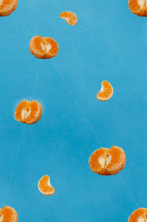 Tangerines floating on a colored background. Patternの写真素材