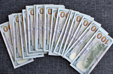 Some 100 dollar bills. cash bucks flow. money