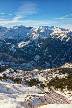 View to the town of wengen in the swiss alps from high mountain in winter jungfrau regionの写真素材