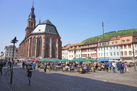 People on central square in Heidelberg near Cathedral at sunny weatherのeditorial素材