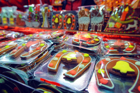Typical Christmas stand with gingerbread cookies on the traditional European Christmas market in Riga's Old Town, Latviaの写真素材
