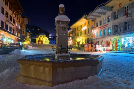 Christmas illumination in the snowy streets of the medieval town of Gruyeres, district of Gruyere, Fribourg canton, Switzerlandのeditorial素材