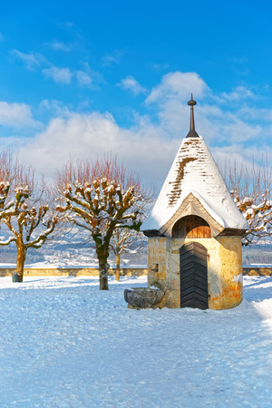 GRUYERE, SWITZERLAND - DECEMBER 31, 2014: Winter view of the Castle of Gruyeres in the town of Gruyeres, Fribourg, Switzerland. It is a Swiss heritage site of national significance.のeditorial素材