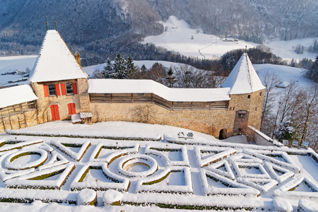 GRUYERE, SWITZERLAND - DECEMBER 31, 2014: French garden behind the castle of Gruyeres on a beautiful winter day. Region of Gruyere, province of Fribourg, Switzerlandのeditorial素材