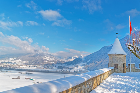 GRUYERE, SWITZERLAND - DECEMBER 31, 2014: Esplanade in front of the castle of Gruyeres in Switzerland on a beautiful winter day.のeditorial素材