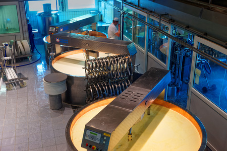 GRUYERE, SWITZERLAND - DECEMBER 31, 2014: Famous cheese factory in the town of Gruyeres in the canton of Fribourg, Switzerland. Gruyere is the most popular  cheese to use in fondueのeditorial素材