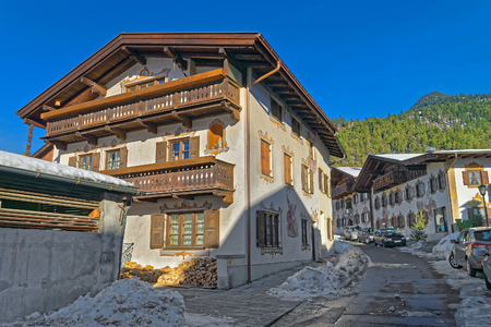 Cozy street in Bavarian Village Garmisch-Partenkirchen (Germany), on a sunny winter day. It is a tourist and winter sports centre and has some of Germany's best skiing areasのeditorial素材