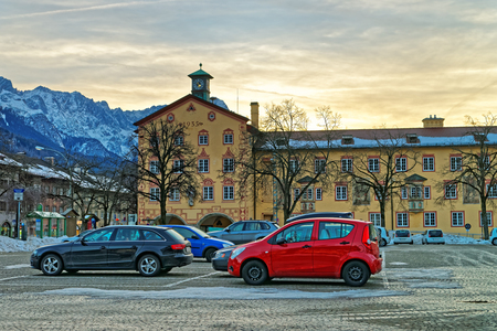 View of a cozy street in a beautiful Alpine town of Garmisch-Partenkirchen in Bavaria, southern Germany, Alps. It is a tourist and winter sports center and has some of Germanys best skiing areasの写真素材