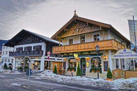 GARMISCH-PARTENKIRCHEN, GERMANY - JANUARY 06, 2015: Enchanting Upper Bavarian-styled homes in Garmisch-Partenkirchen beautifully decorated for the Christmas holidaysのeditorial素材