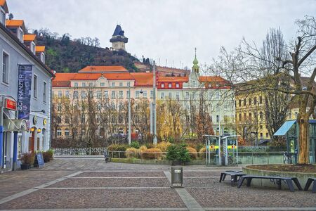 GRAZ, AUSTRIA - JANUARY 7, 2014: Street view to the Clock tower of the Castle Hill in Graz in Austria in Januaryのeditorial素材