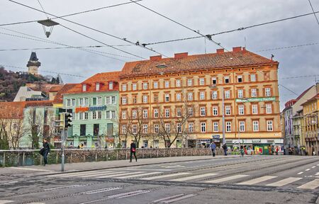GRAZ, AUSTRIA - JANUARY 7, 2014: View from the bridge to Clock tower of the Castle Hill in Graz in Austria in Januaryのeditorial素材