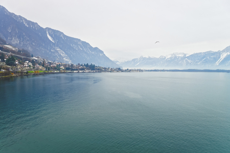 Panoramic View to Montreux and Lake Geneva in winter. Montreux is a city in the canton of Vaud in Switzerland. It is located on Lake Geneva at the foot of the Alps.の写真素材