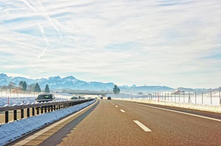 View of road with cars in Switzerland in winter.の写真素材