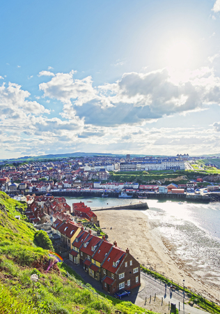 Coast of North Sea in Whitby in North Yorkshire in England. Whitby is a seaside port and town on the coast of the river Esk.の写真素材