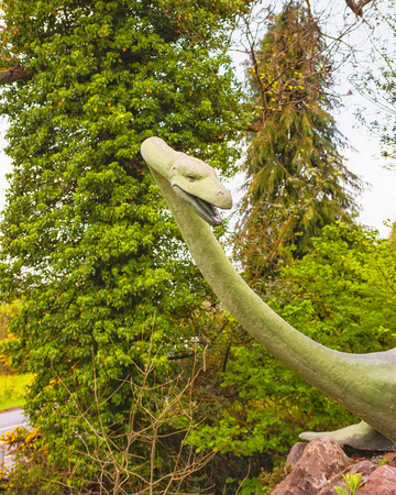 DRUMNADROCHIT, SCOTLAND - MAY 9, 2011: Nessie, Loch ness monster statue in Loch Ness in Scotland. Loch Ness is a city in the Highlands in Scotland in the United Kingdom.のeditorial素材