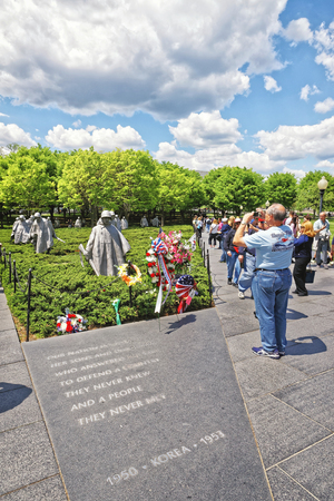 Washington DC, USA - May 2, 2015: Tourists and War Veterans and guardians of Honor Flight nonprofit organization at Korean War Veterans Memorial in West Potomac Park in National Mall.のeditorial素材
