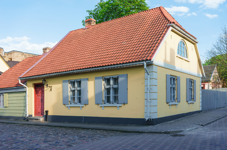 Yellow painted Old house in Ventspils in Latvia. It is a city in the Courland region of Latvia. Latvia is one of the Baltic countriesのeditorial素材