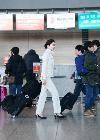 Incheon, South Korea - February 15, 2016: Asian Korean female flight attendant in the Incheon international airport. It is one of the largest and busiest world airportsのeditorial素材
