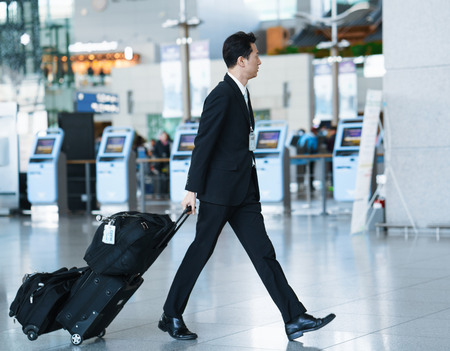 Incheon, South Korea - February 15, 2016: Asian male air flight attendant in International airport of Incheon. It is one of the largest and busiest world airports.のeditorial素材