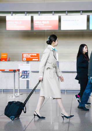 Incheon, South Korea - February 15, 2016: Asian Korean female air flight hostess in Incheon International airport. It is one of the largest and busiest world airports.のeditorial素材