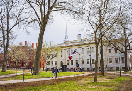Cambridge, USA - April 29, 2015: University Hall and John Harvard Monument in the campus of Harvard University, Massachusetts, MA, the USA. It is well-known statue of Harvard University founder in America.のeditorial素材