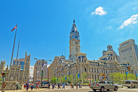 Philadelphia, USA - May 4, 2015: Philadelphia City Hall with William Penn figure atop the Tower. View from the street. Tourists in the streetのeditorial素材