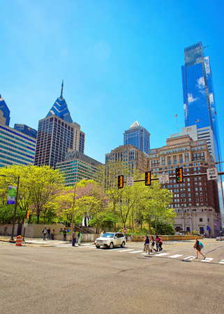Philadelphia, USA - May 4, 2015: JFK boulevard and Penn Center with skyscrapers in Philadelphia, Pennsylvania, USA. It is central business district in Philadelphia. Tourists in the streetのeditorial素材