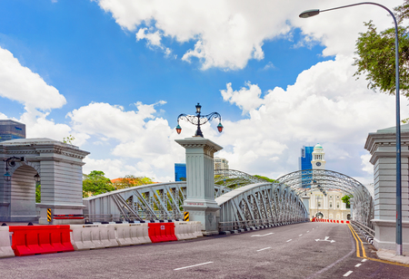 Singapore, Singapore - March 1, 2016: Anderson Bridge over Singapore River. Skyscrapers on the background.のeditorial素材
