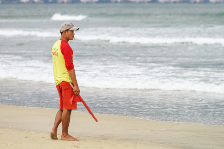Danang, Vietnam - February 20, 2016: Beach inspector passing by at the China Beach in Danang in Vietnam.のeditorial素材