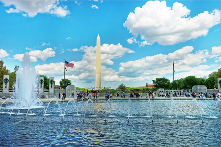 Washington DC, USA - May 2, 2015:  Fountain which is located in the National World War II memorial with the Washington monument in the background. Both are very important symbols.のeditorial素材