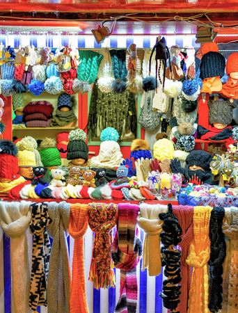 Riga, Latvia: Stall with warm clothes such as hats, gloves, scarfs and socks photographed at the Christmas Market in Riga, Latvia.の写真素材