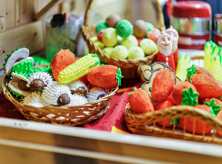 Stall with traditional colorful and festive sweets on Christmas Market in Vilnius in Lithuania. Candies are very popular at such marketsの写真素材