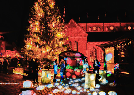 Riga, Latvia - December 24, 2015: Illumination and People at the Christmas market at Dome square in old Riga. At nightのeditorial素材