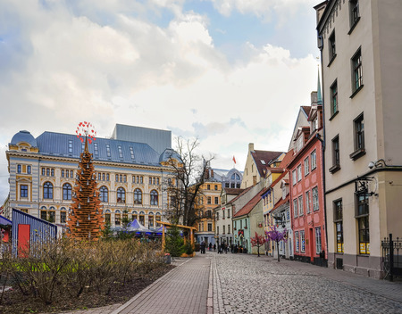 People on the Christmas market located on the Livu square in the center of the old town in Riga, Latvia.の写真素材