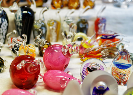 Small glass figurines displayed for sale at the Christmas market in old Riga, Latvia. The market takes place from the beginning of December till the start of January each year.の写真素材