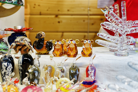 Monkey figures as the symbol of the upcoming year and other glass statues displayes for sale at the Christmas market in Riga, Latvia. It can be a great gift for friends and relatives.の写真素材
