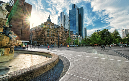 Frankfurt am Main, Germany - April 29, 2012: With special sun flare. Architecture of Untermainanlage street with skyscrapers in the business center of Frankfurt am Main. People on the background.のeditorial素材