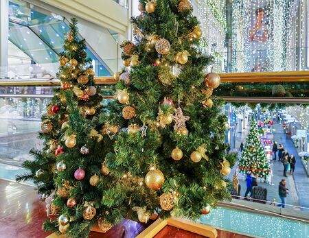 Riga, Latvia - December 25, 2015: One of the many Christmas trees located at the Galerija Centrs in old Riga, Latvia. Vintage filter is applied.のeditorial素材