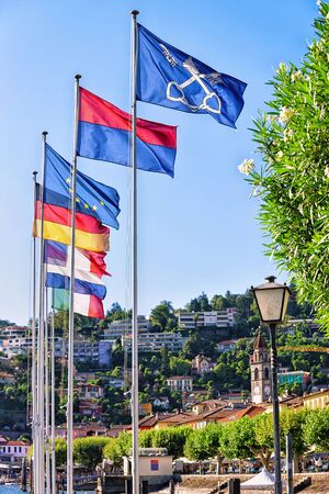 Ascona, Switzerland - August 23, 2016: Flags at the luxurious resort in Ascona on Lake Maggiore of Ticino canton, Switzerland.のeditorial素材